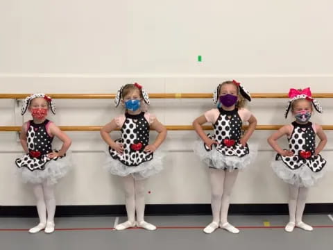 a group of girls wearing clothing