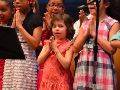a group of people clapping