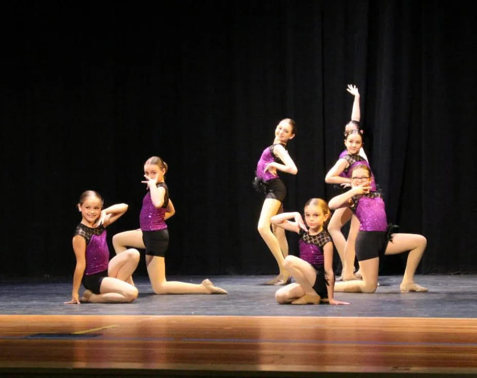 a group of girls on a stage