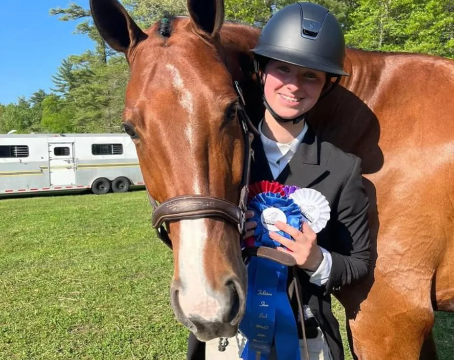 a man holding a horse