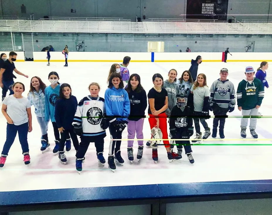 a group of people on an ice rink