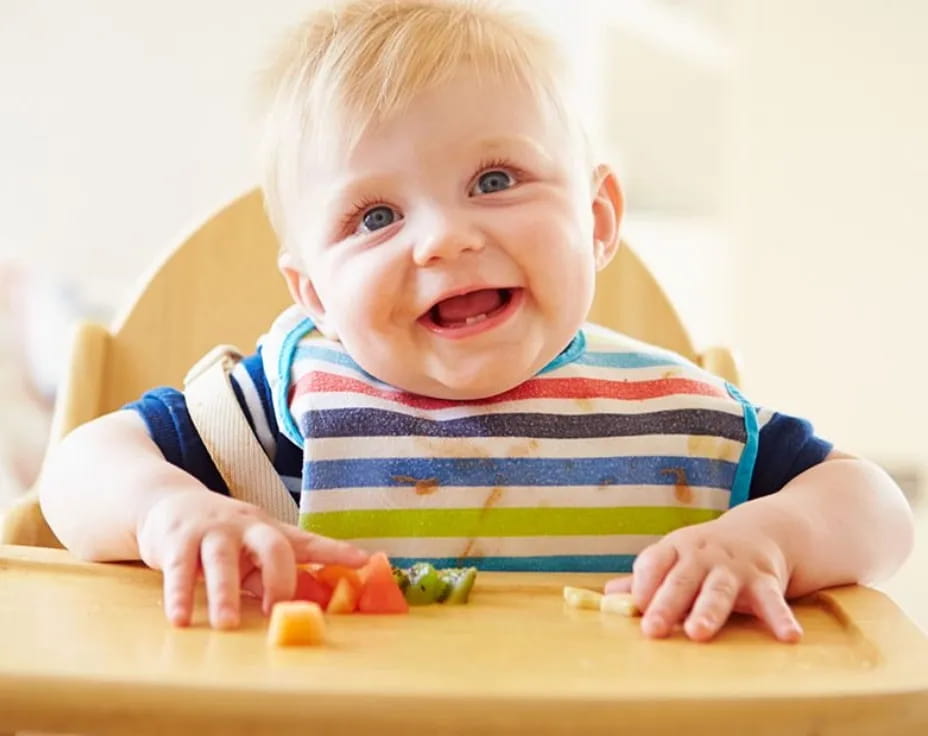 a baby playing with toys