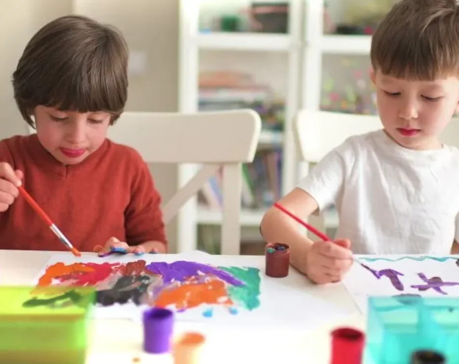 a couple of kids painting