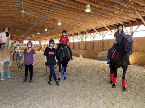 a group of people with horses