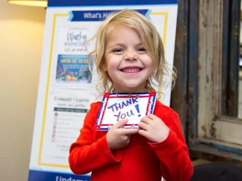 a child holding a book