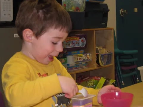a boy sitting at a table