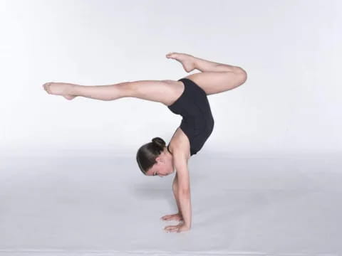 a person doing a handstand
