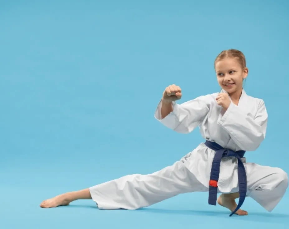 a young girl in a karate uniform