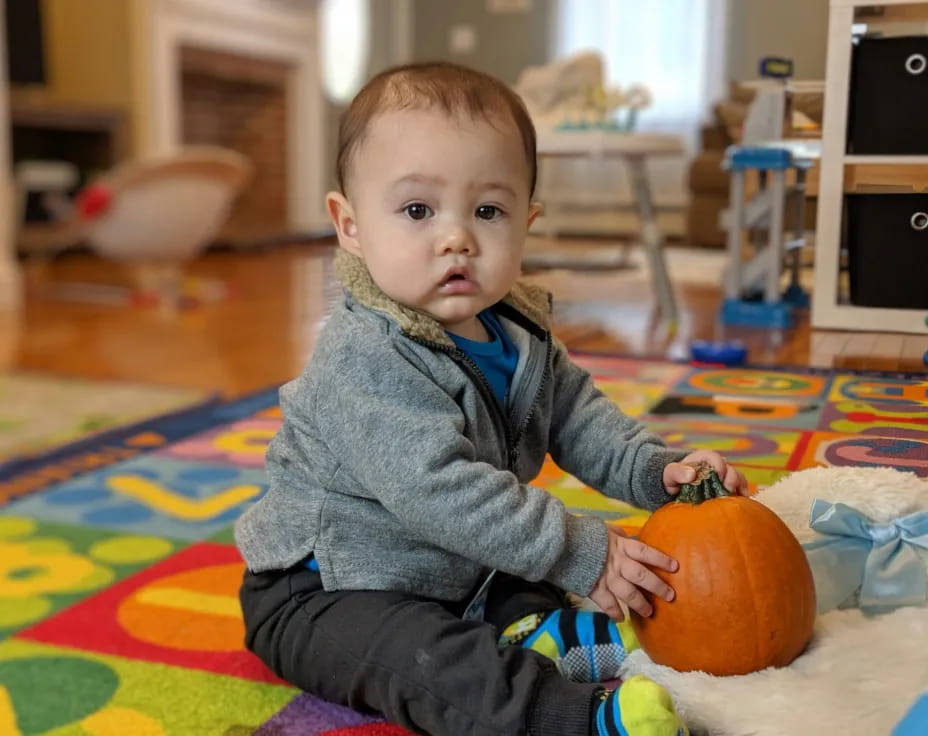 a baby sitting on the floor
