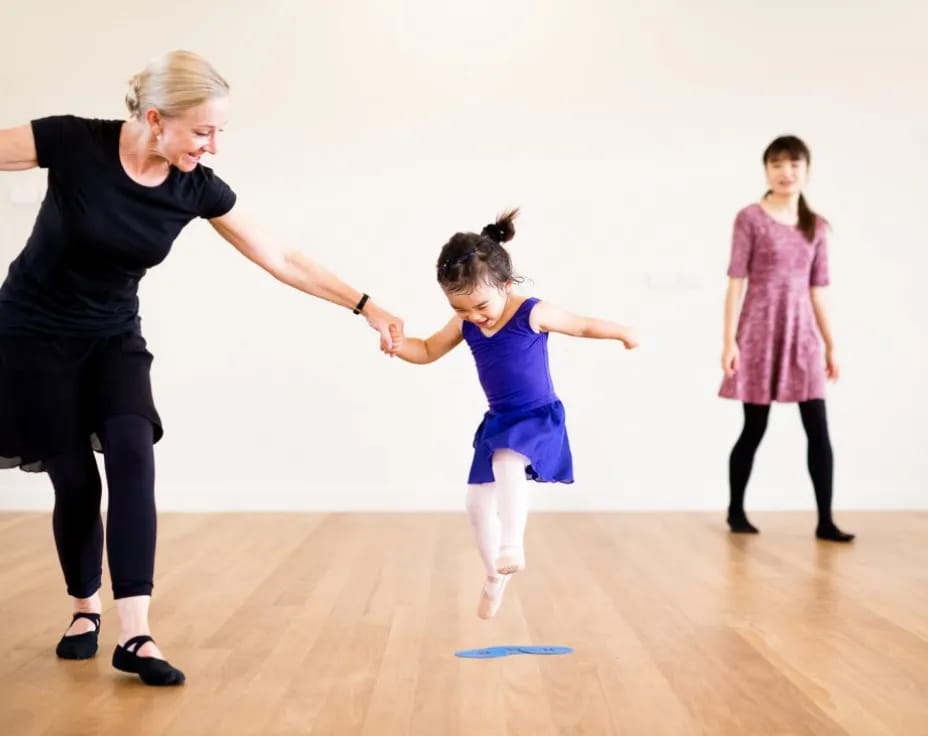 a person and a girl dancing