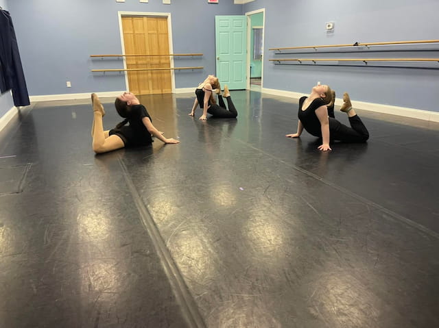 a group of people sitting on the floor
