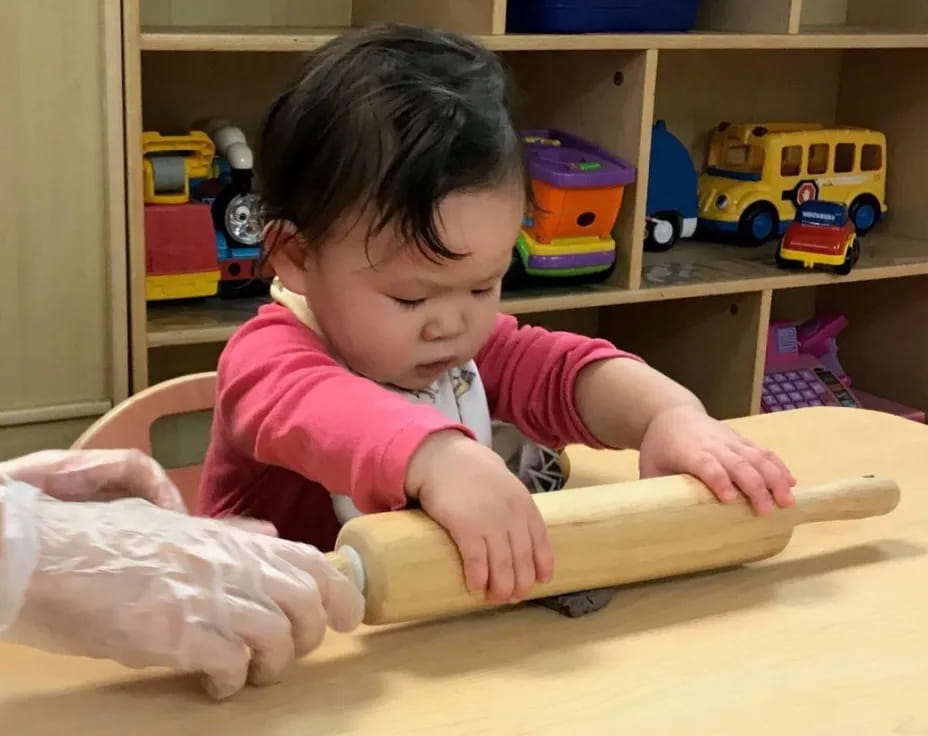 a baby playing with a toy