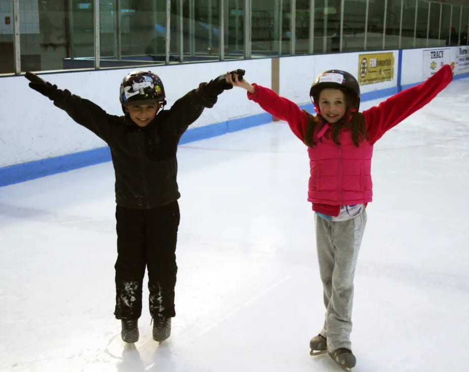 a couple of people on ice