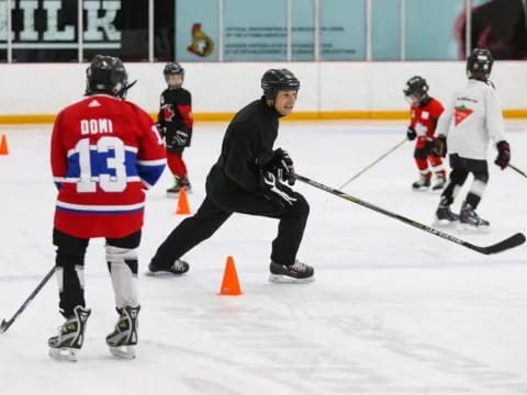 a group of people playing hockey
