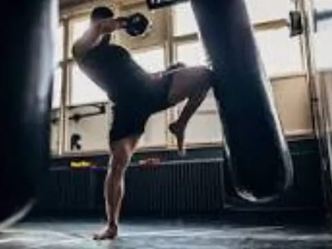 a person lifting another man