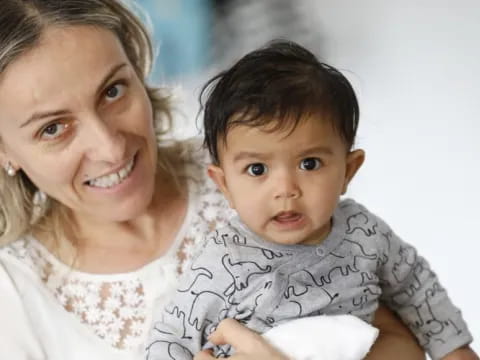 a person holding a baby
