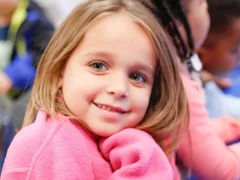 a girl smiling at the camera
