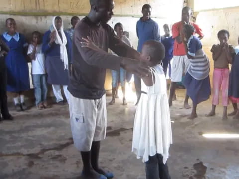 a person and a child dancing