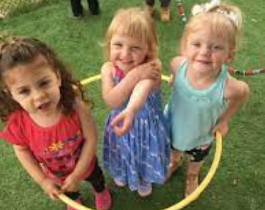 a group of girls playing in a yard