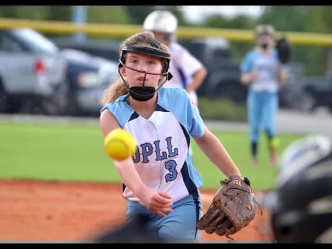 a girl catching a baseball