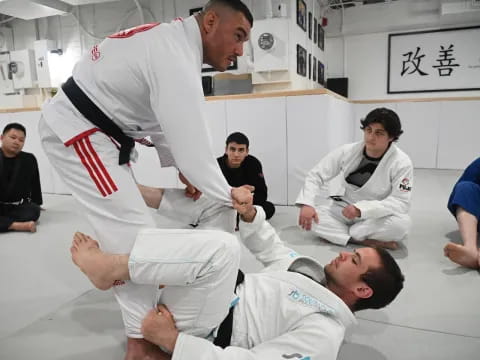 a group of men in karate uniforms