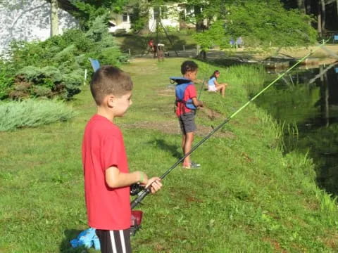 a group of kids fishing