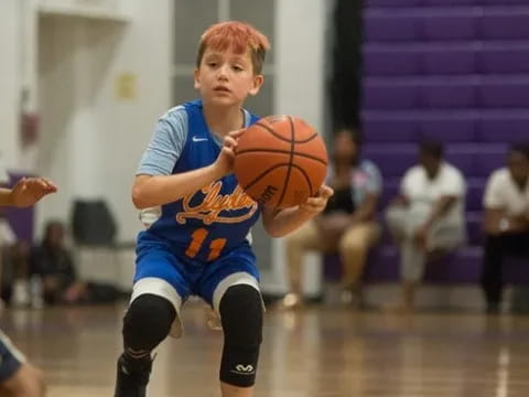 a boy playing basketball