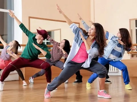 a group of girls doing yoga