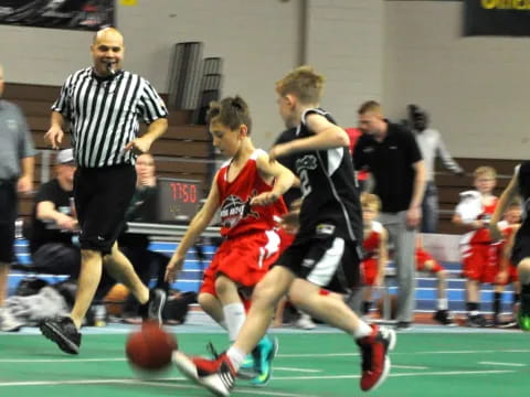 a group of men playing basketball