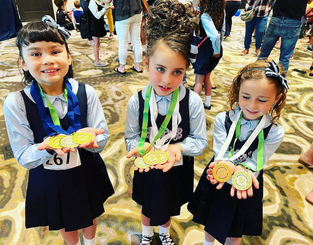 a group of girls wearing matching outfits