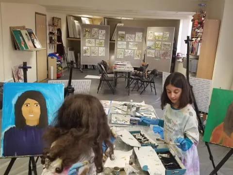 a girl sitting at a table
