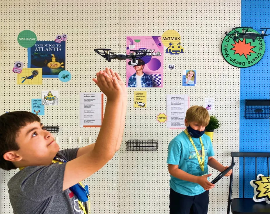 a couple of boys in a classroom