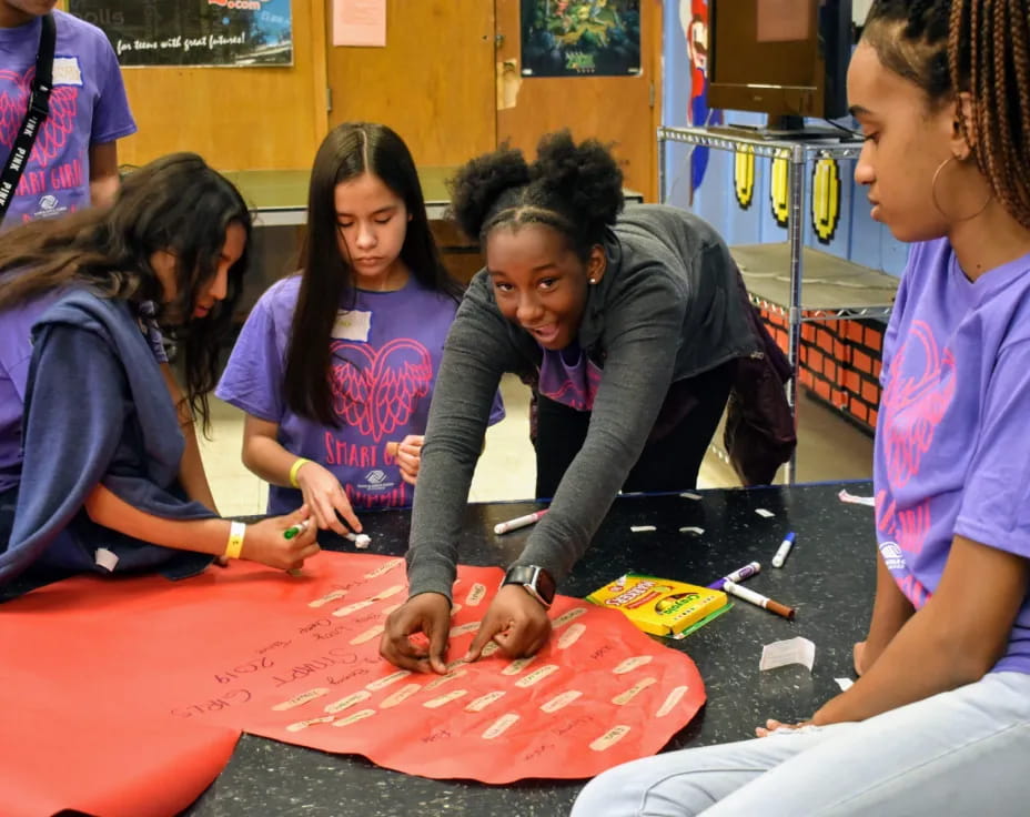 a group of people painting