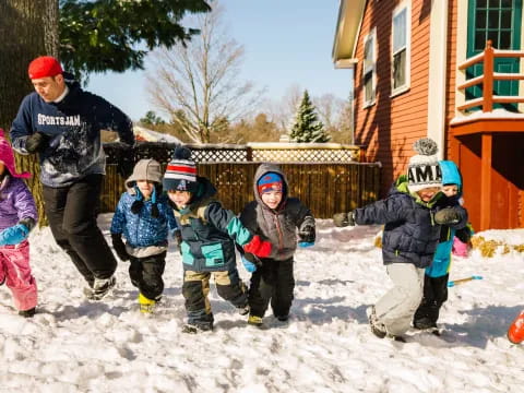 a group of kids in the snow