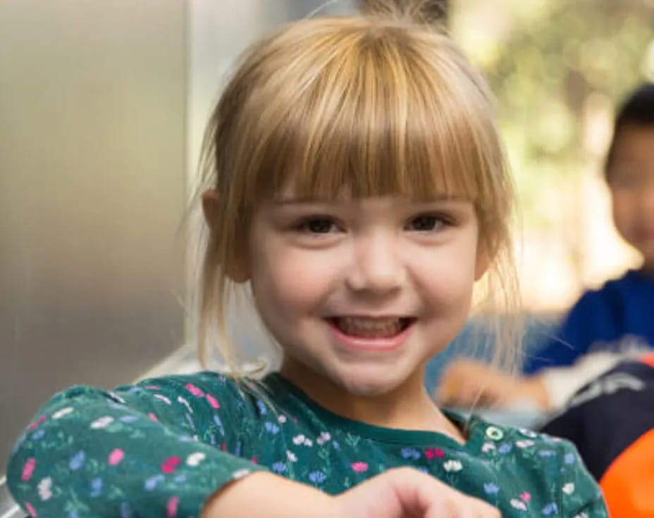 a child holding a toy