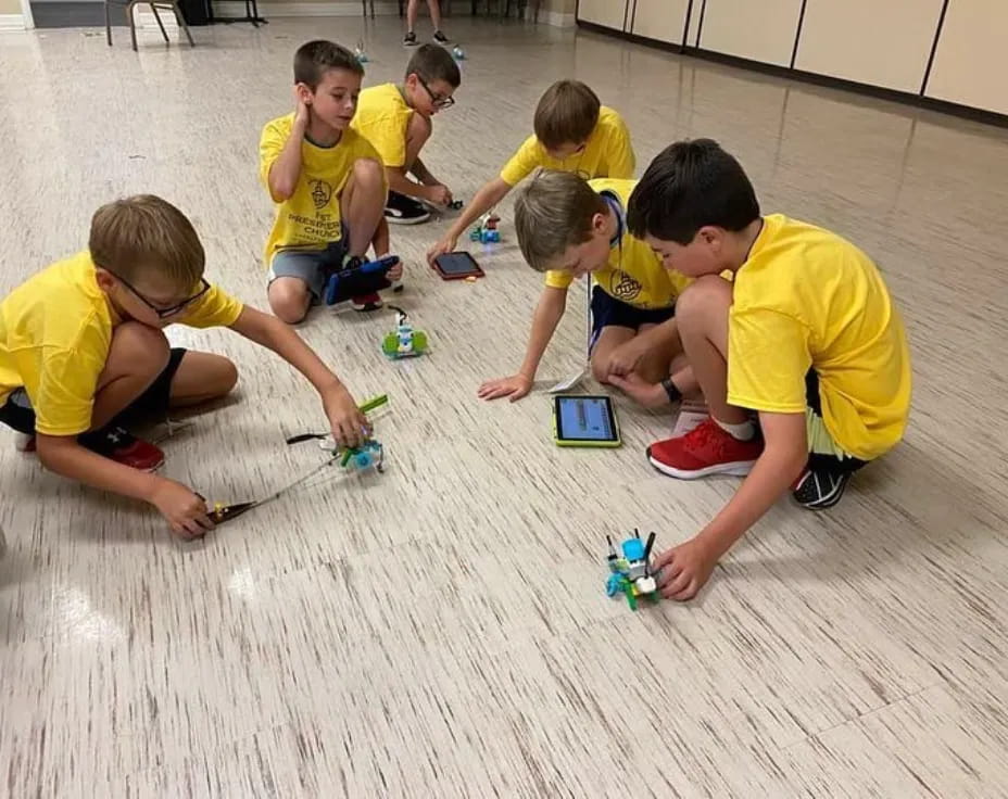 a group of kids playing with toys