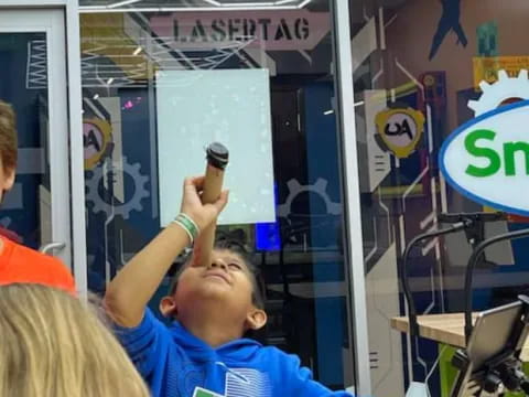 a boy holding a phone