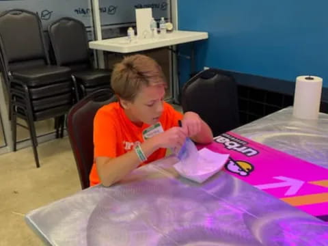 a child sitting at a table