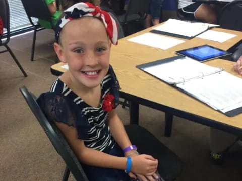 a child sitting at a desk
