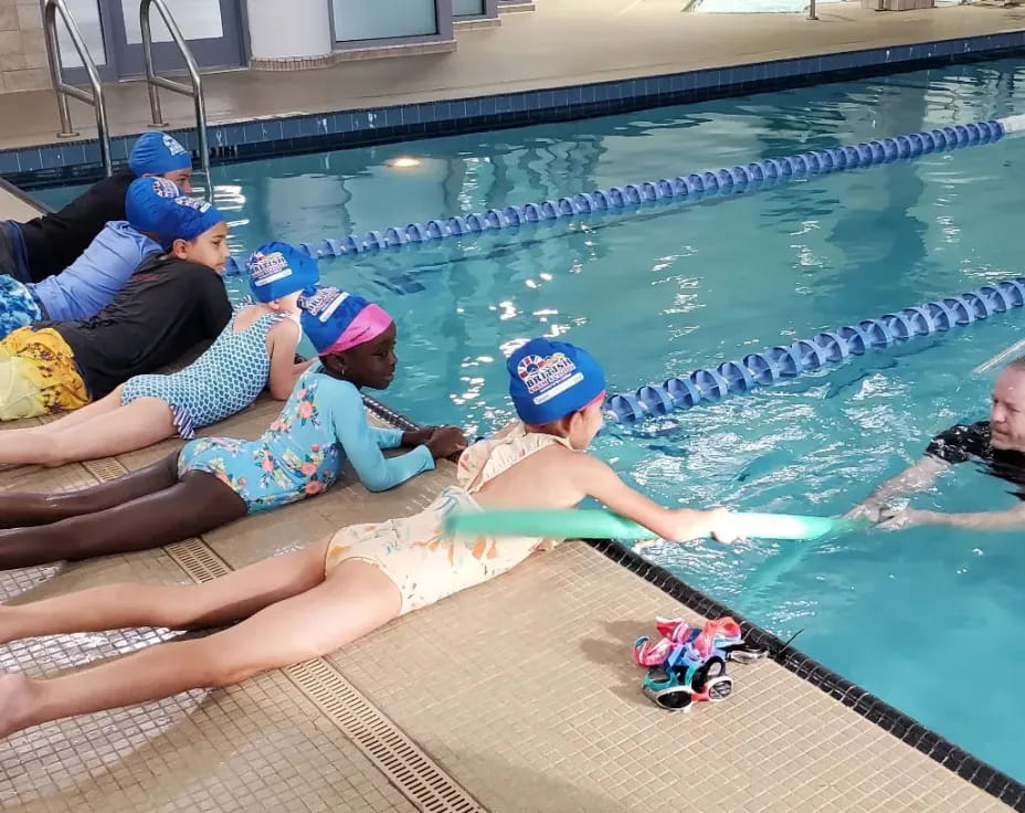 a group of people in a pool