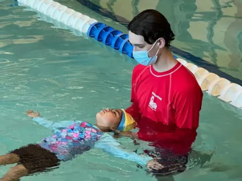 a person in a red shirt in a pool