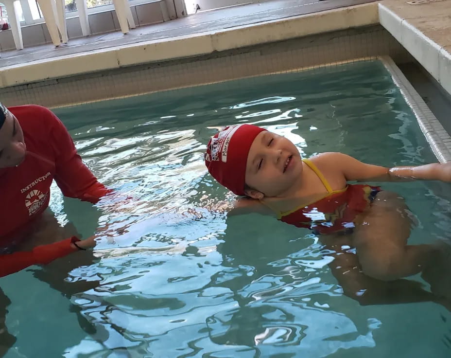 two kids in a pool