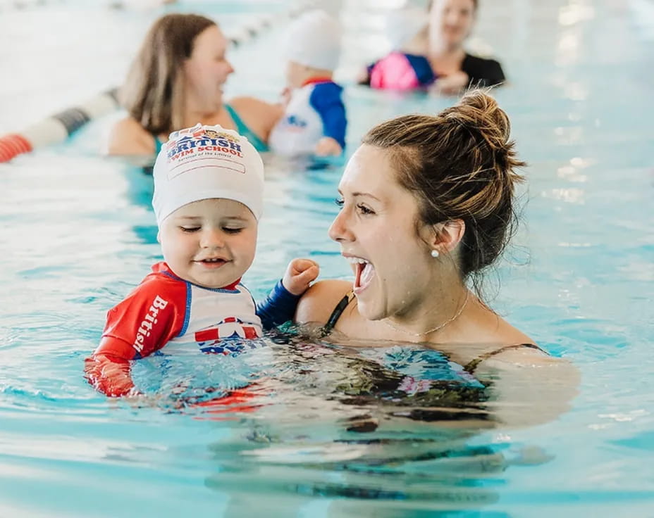 a person and a child in a pool