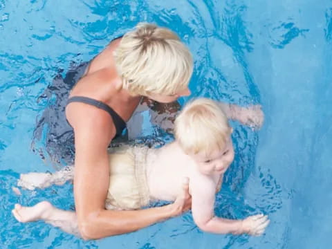 a person holding a baby