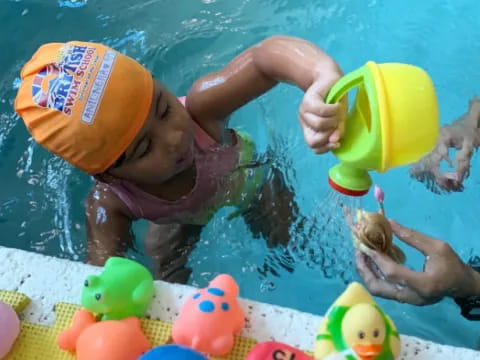 a child in a pool with toys