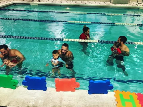 a group of people in a pool
