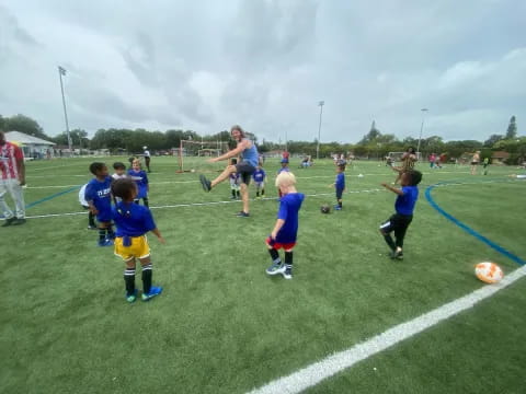 a group of kids playing football