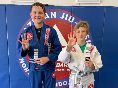 two boys holding up a trophy