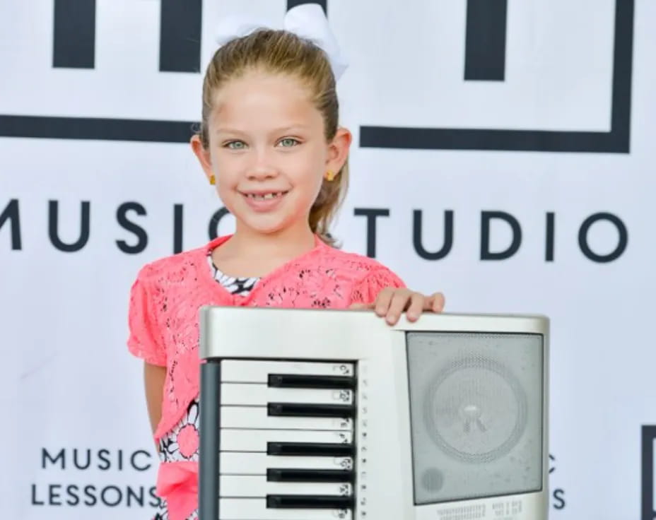 a girl holding a computer