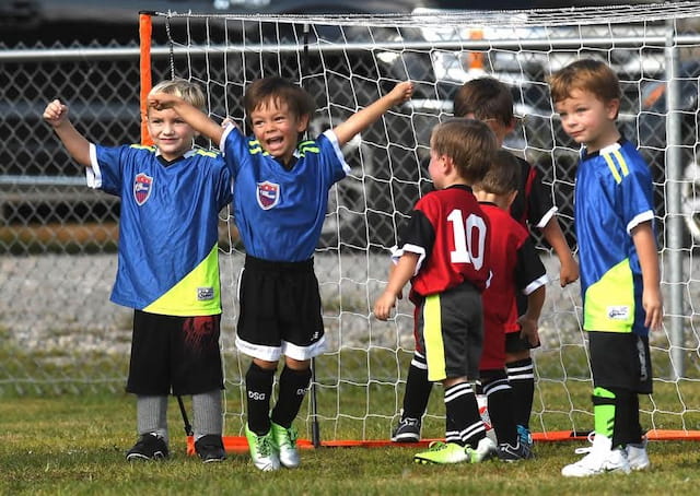 a group of boys in football uniforms